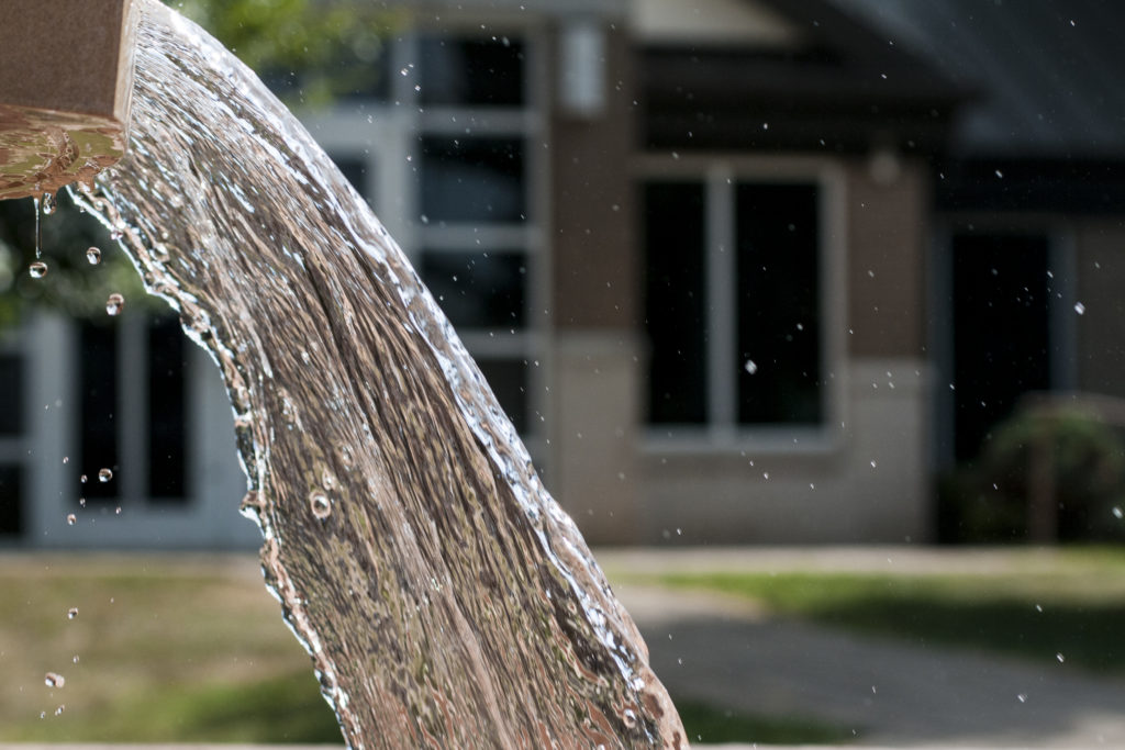 Waterfalling from fountain.