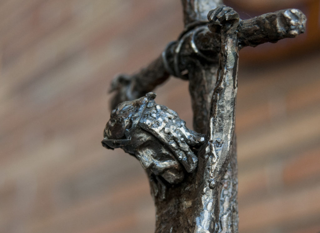 Sculpture of Jesus nailed to the cross.