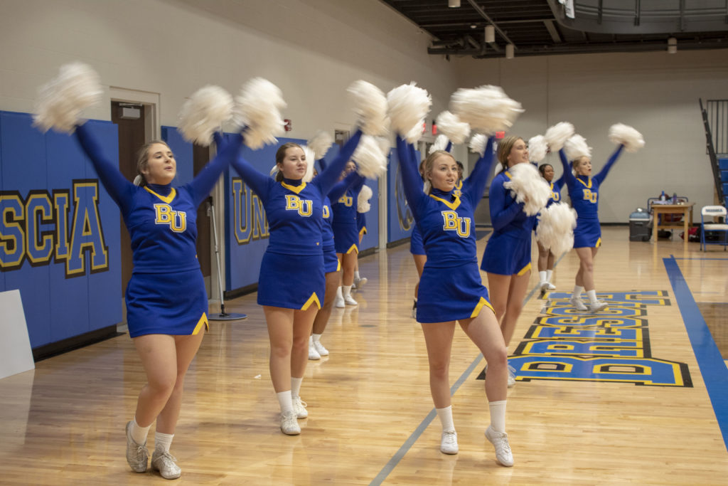 Cheer team performing during a home basketball game